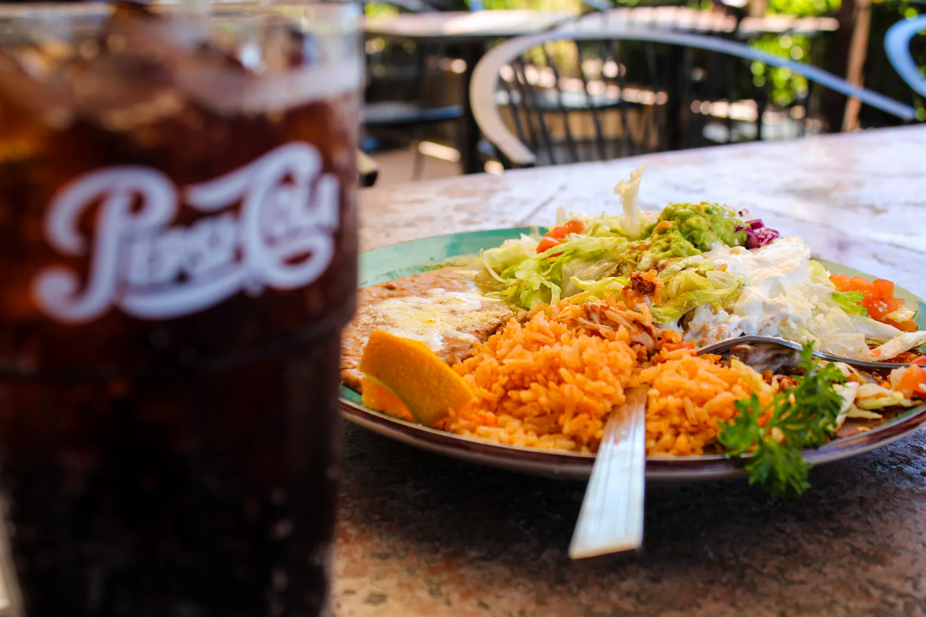 Combination plate with rice, beans and guacamole on the patio